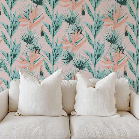 printed grasscloth wallpaper light pink based allover floral print with light pink and orange birds of paradise floral paired with shades of green palm leaves with added light pink lipstick tubes scattered throughout the print. Natural Textured Eco-Friendly Non-toxic High-quality Sustainable practices Sustainability Interior Design botanical medspa beauty salon custom wall cover garden