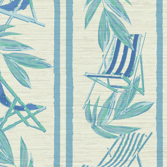 vertical linear grasscloth wallpaper print with a beachy design of blue leaves and stripes paired with shades of blue beach chairs arranged in a vertical oversized stripe Grasscloth Natural Textured Eco-Friendly Non-toxic High-quality Sustainable practices Sustainability Interior Design Wall covering bold Seaside Coastal Seashore Waterfront Vacation home styling Retreat Relaxed beach vibes Beach cottage Shoreline Oceanfront Nautical