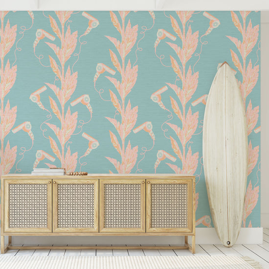 light blue based printed grasscloth wallpaper with light pink and orange palm leaf vertical stripes paired with hair blow dryers popping out of them Grasscloth Natural Textured Eco-Friendly Non-toxic High-quality  Sustainable practices Sustainability Interior Design Wall covering Bold Wallpaper Custom Tailor-made Retro chic Tropical Salon  Beauty Hair Garden jungle