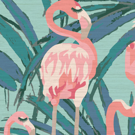 dusty teal printed grasscloth wallpaper with oversized palm leaves layered with extra large flamingos in shades of pink with unexpected luscious eyelashes