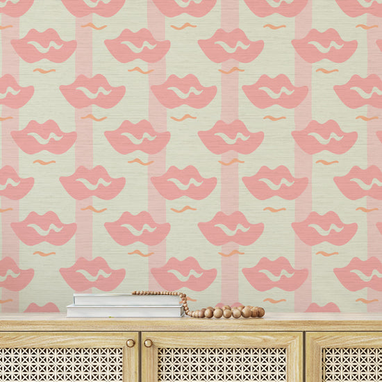 Load image into Gallery viewer, white with light pink stripe printed grasscloth wallpaper with oversized tonally darker pink lips arranged in a grid-like pattern.
