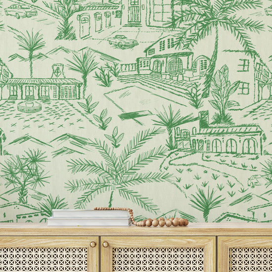 Paperweave paper weave printed modern toile design featuring a 2 color print with Spanish style houses, variety of palm trees and tropical and desert inspired plants, massive pools, vintage cars and fountains with mountains in the background foyer entrance