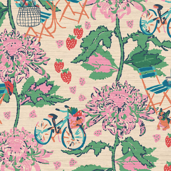 Printed grasscloth wallpaper inspired by the french market, off white base with linear pink florals arranged in vertical stripes.  filled in between are tiny scenes of bicycles with a basket full of market groceries, a bistro set of furniture featuring a bottle of pellegrino and glasses; mixed fruit scattered throughout the print. food fruit bistro chair table