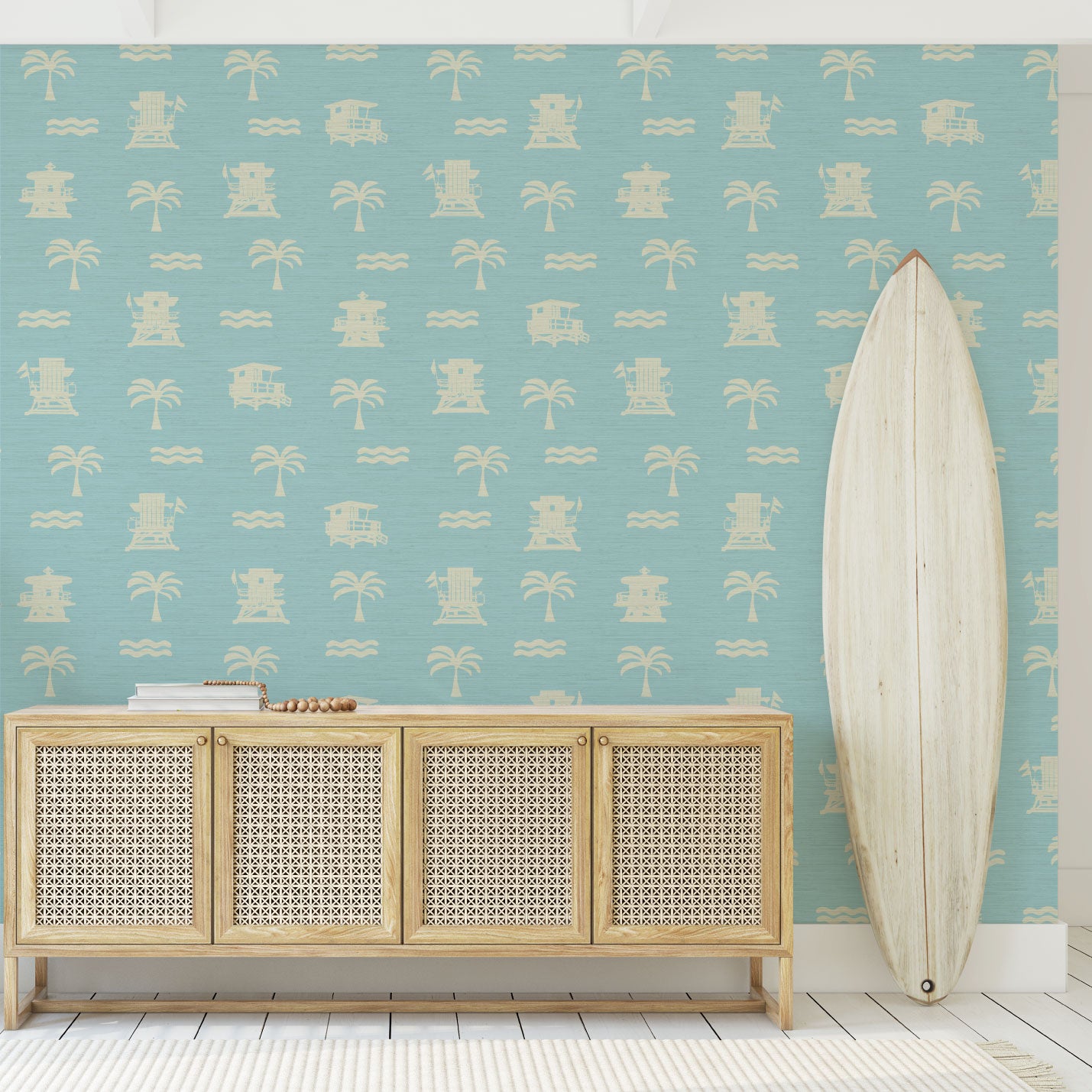Load image into Gallery viewer, Entrance with blue base grasscloth wallpaper with white print of lifeguard stands, waves and palm trees in a mini icon print

