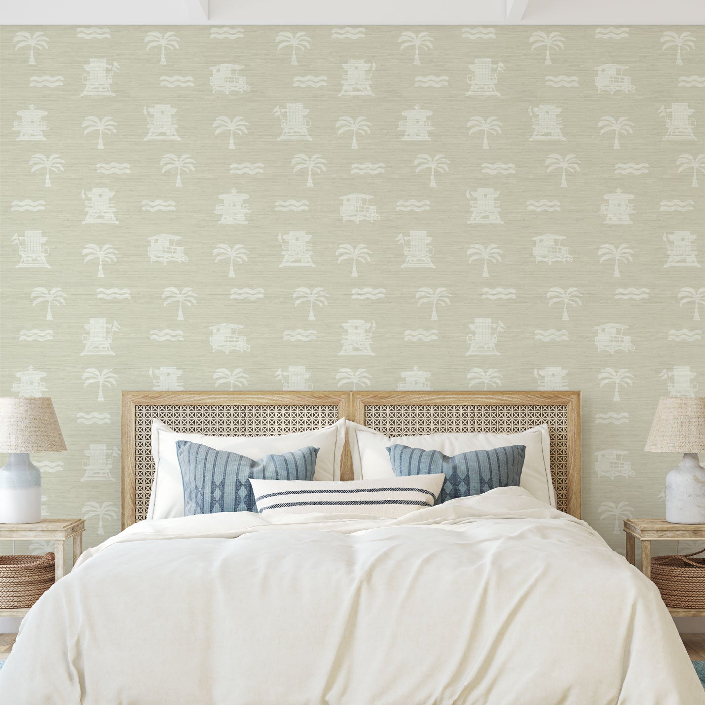Bedroom with tan base grasscloth wallpaper with white print of lifeguard stands, waves and palm trees in a mini icon print