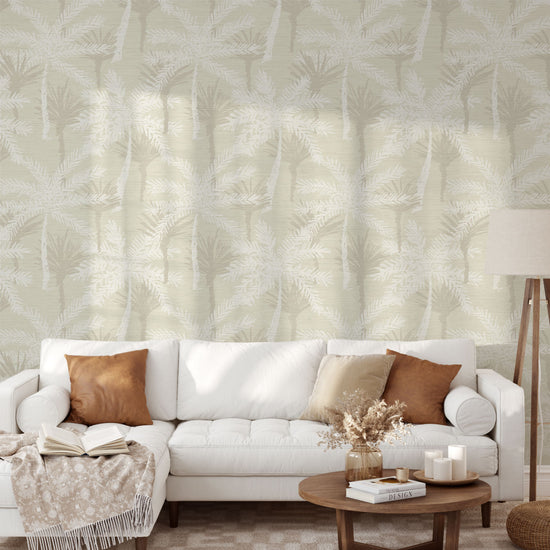 grasscloth printed wallpaper with a cream base color with tonal linear and overlapping palm trees in a variety of shades of tan and white
