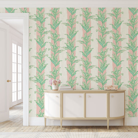 printed grasscloth with light pink and white vertical cabana stripes overlayed with light green and aqua shades of palm leaves also arranged in a vertical stripe cascading down the wallpaper  Natural Textured Eco-Friendly Non-toxic High-quality  Sustainable Interior Design Bold Custom Tailor-made Retro chic Tropical Jungle Coastal Garden Seaside Coastal Seashore Waterfront Vacation home styling Retreat Relaxed beach vibes Beach cottage Shoreline Oceanfront Nautical Cabana preppy palm leaf paperweave