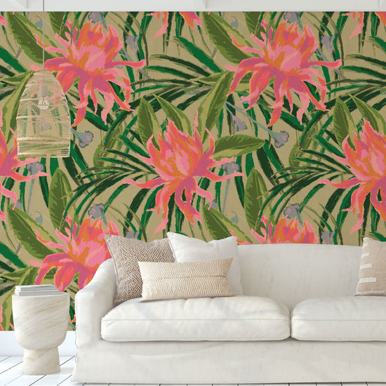 paperweave paper weave wallpaper with olive green based featuring oversized painterly tropical flowers and palm leafs in striking shades of pink, orange and lavender and leafs in shades of deep green Natural Textured Eco-Friendly Non-toxic High-quality Sustainable Interior Design Bold Custom Tailor-made Retro chic Tropical Jungle Coastal preppy Garden Seaside Coastal Seashore Waterfront Vacation home styling Retreat Relaxed beach vibes Beach cottage Shoreline Oceanfront botanical palm leaf living room