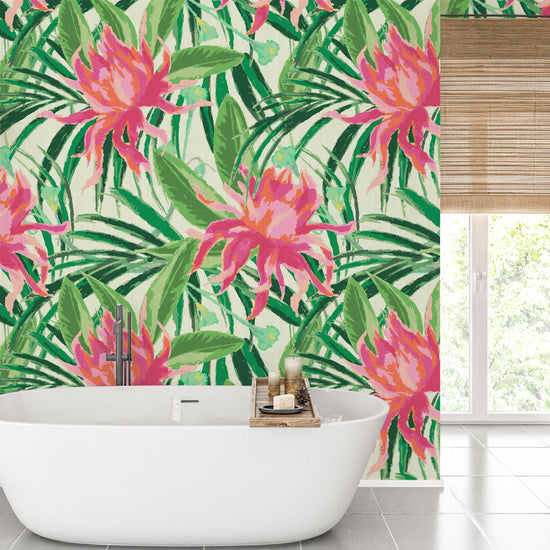 grasscloth wallpaper with cream based featuring oversized painterly tropical flowers and palm leafs in striking shades of pink and orange and leafs in shades of bright green Natural Textured Eco-Friendly Non-toxic High-quality Sustainable Interior Design Bold Custom Tailor-made Retro chic Tropical Jungle Coastal preppy Garden Seaside Coastal Seashore Waterfront Vacation home styling Retreat Relaxed beach vibes Beach cottage Shoreline Oceanfront botanical palm leaf