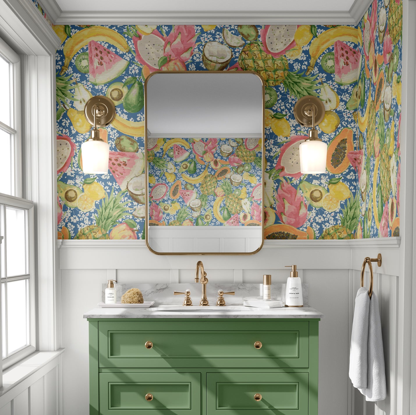 Bathroom with grasscloth wallpaper hand painted with watercolors, blue based print with white ditsy florals with tossed fruit layered on top including: pineapples, limes, bananas, avocados, lemons, pears, peaches, watermelon, coconuts, mangos, bananas and passion fruit