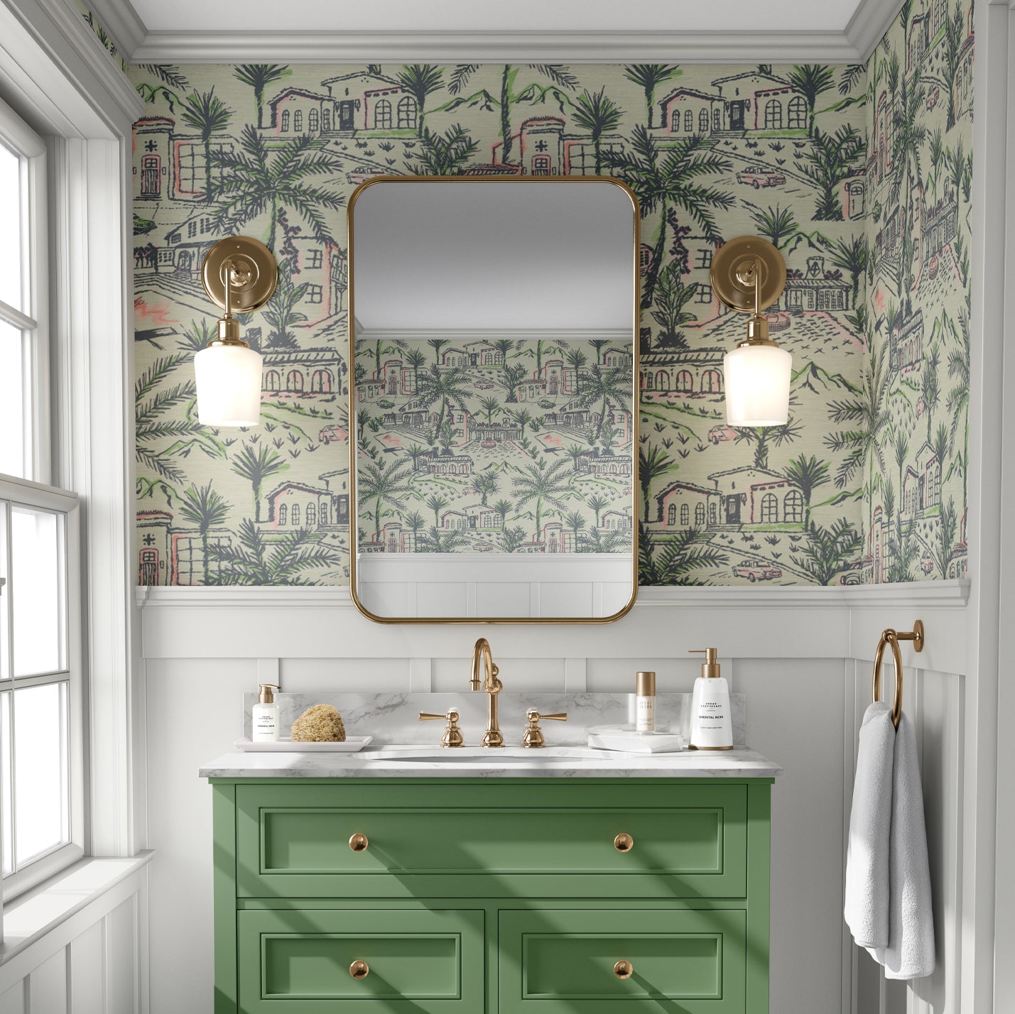 Bathroom with grasscloth wallpaper in modern toile print with Spanish style architecture houses, palm trees, pools, 1980s vintage cars mountains in the background. The print is a light green base with dark green, bright neon green and splashes of neon coral print