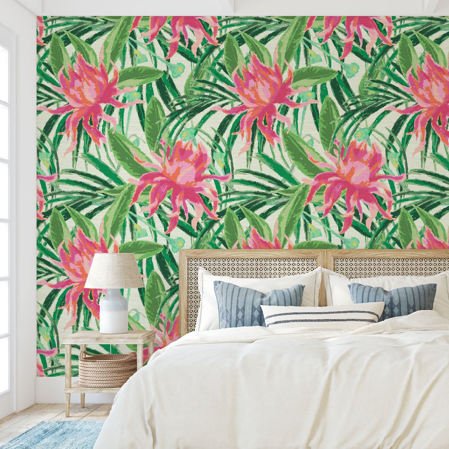 Bedroom with grasscloth wallpaper with cream based featuring oversized painterly tropical flowers and palm leafs in striking shades of pink and orange and leafs in shades of bright green