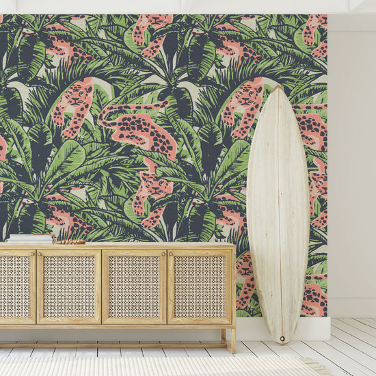 Foyer entrance with grasscloth printed wallpaper on off white base with allover palm prints in a variety of leaf shapes and variatals. Print includes neon cheetah in a paper cutout artwork aesthetic creeping through the palm leafs and locking eyes with the viewer.